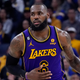 Los Angeles Lakers forward LeBron James dribbles up the court during the second half of an NBA basketball game against the Golden State Warriors in San Francisco, Tuesday, Oct. 18, 2022.